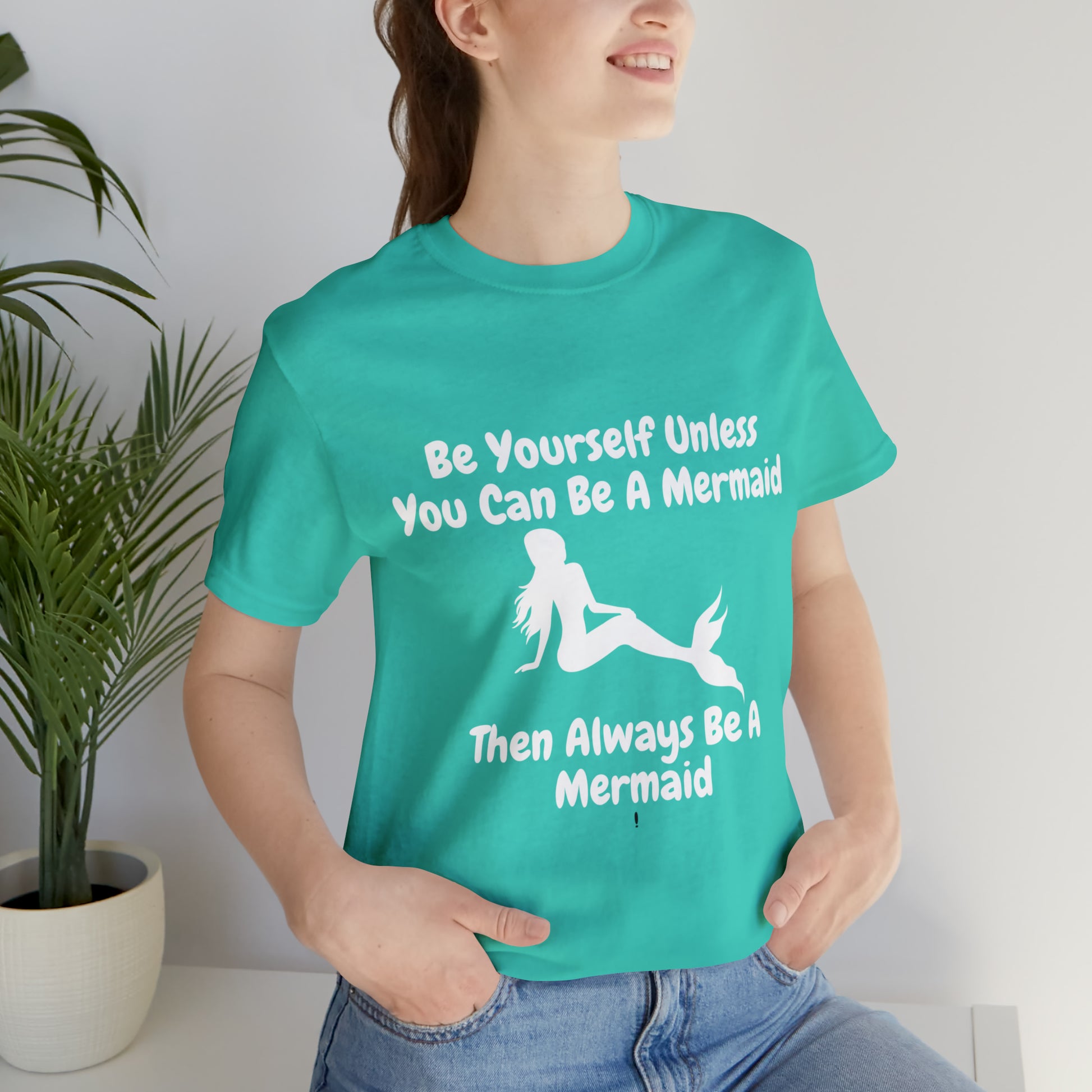 Be a Mermaid T-Shirt - Unisex jersey tee with an enchanting design, soft cotton fabric, and ribbed knit collars, perfect for mermaid enthusiasts and lovers of mermaid-inspired clothing.